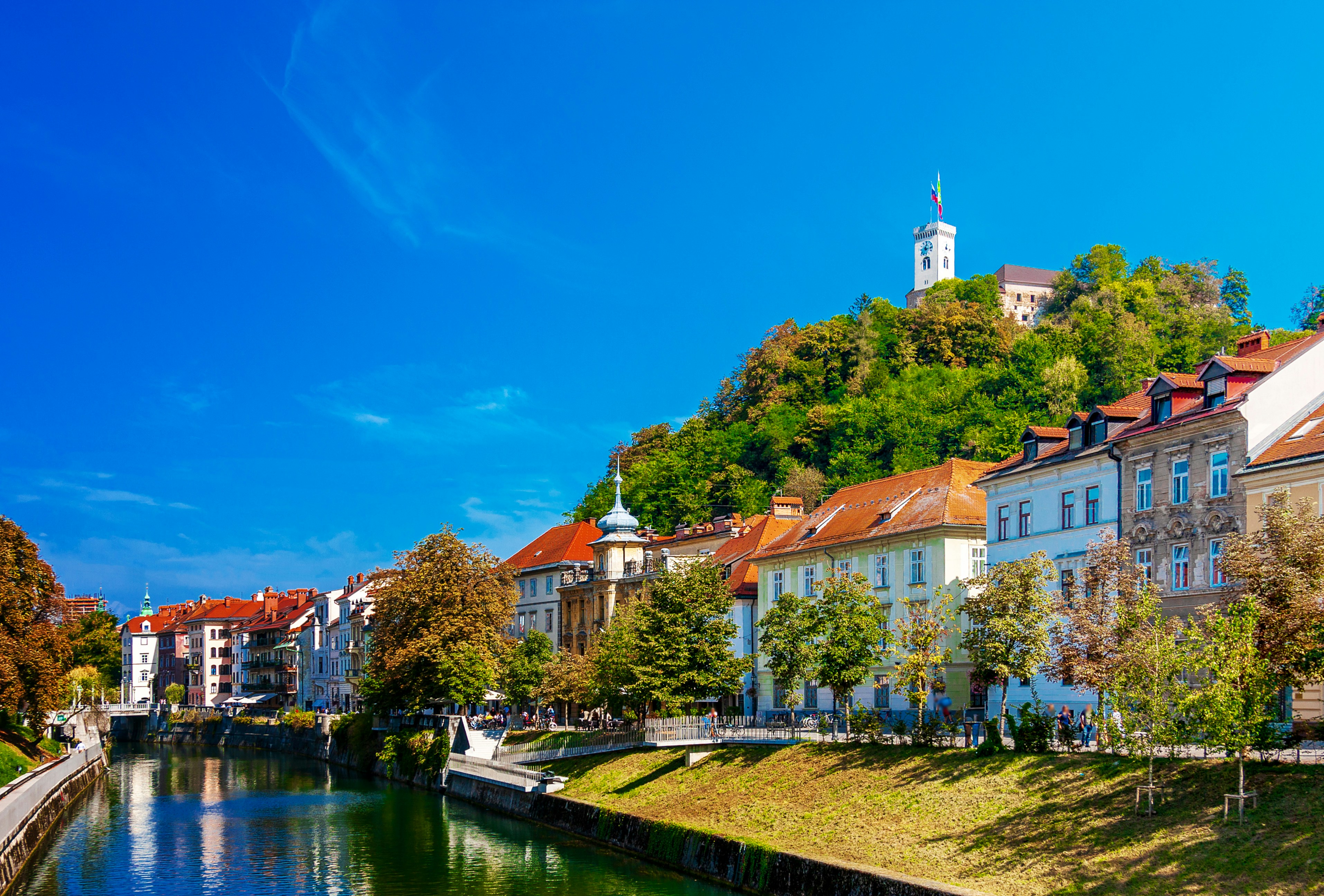 Riverside buildings along the Ljubljanica river in Ljubljana on a clear day