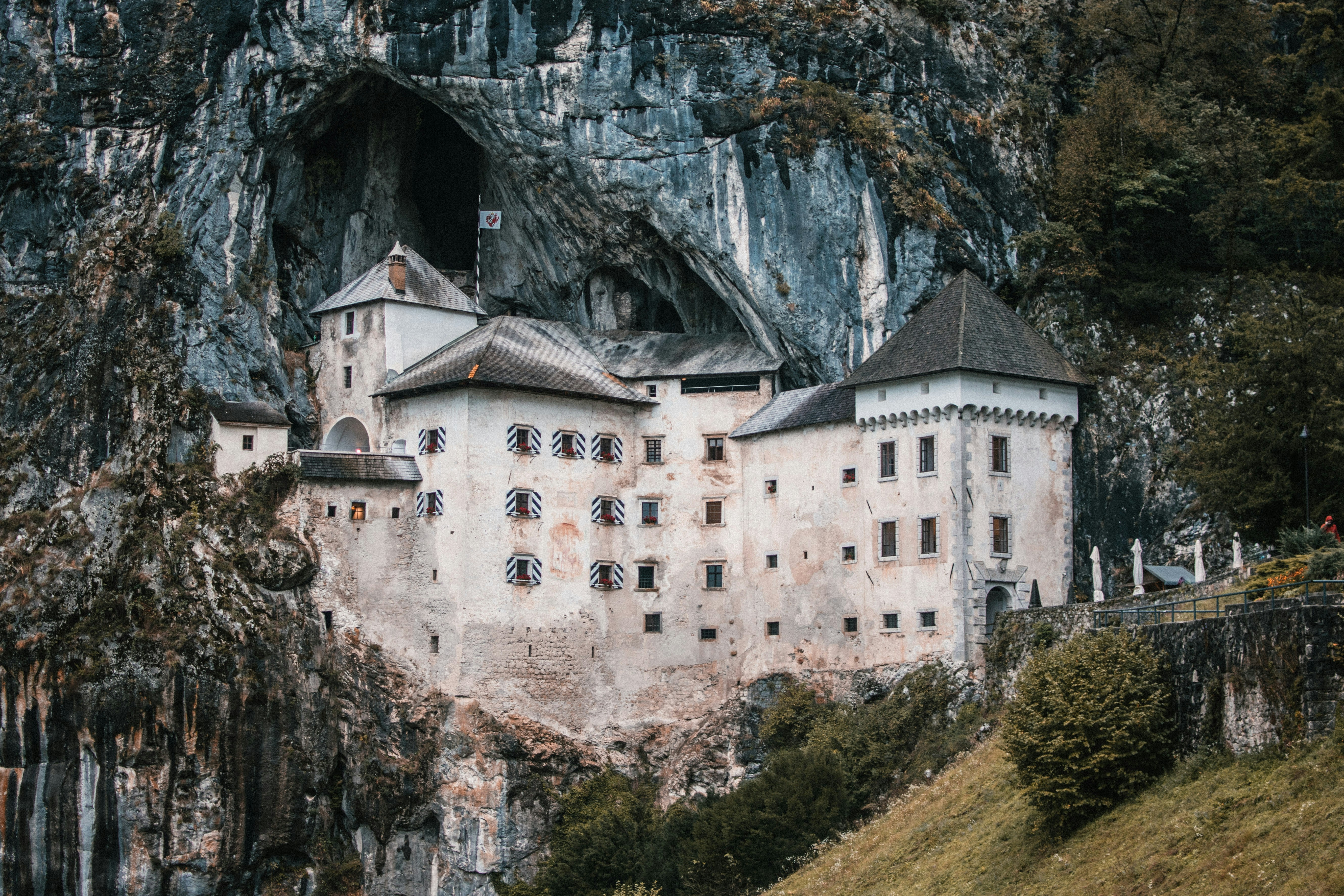 Predjama Castle built into the mouth of a cliff cave